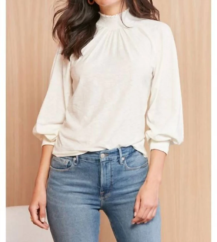 Melanie Smocked Peasant Tee In Off White Asymmetrical Pockets Print